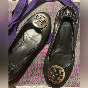 Tory Burch black leather with silver hardware. With shopping bag.